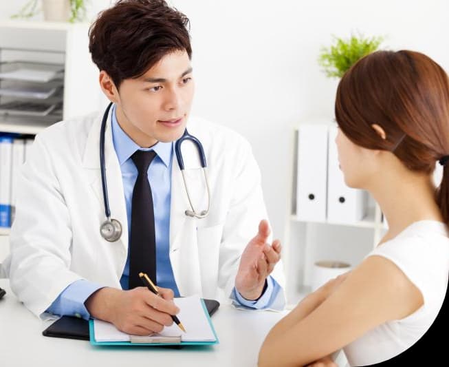 Picture of doctor listening to lung sounds